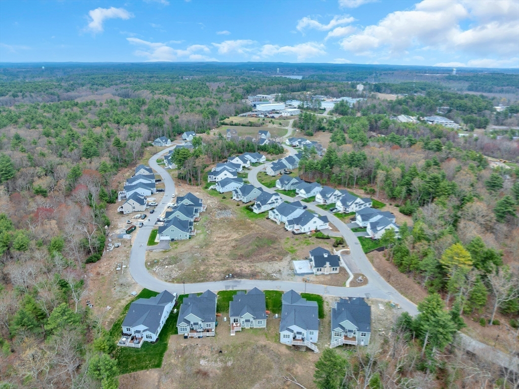 8 Weber Farm Road, Unit 8 Wrentham, MA 02093 - Photo 35 of 35 an aerial view of a house with a yard and lake view