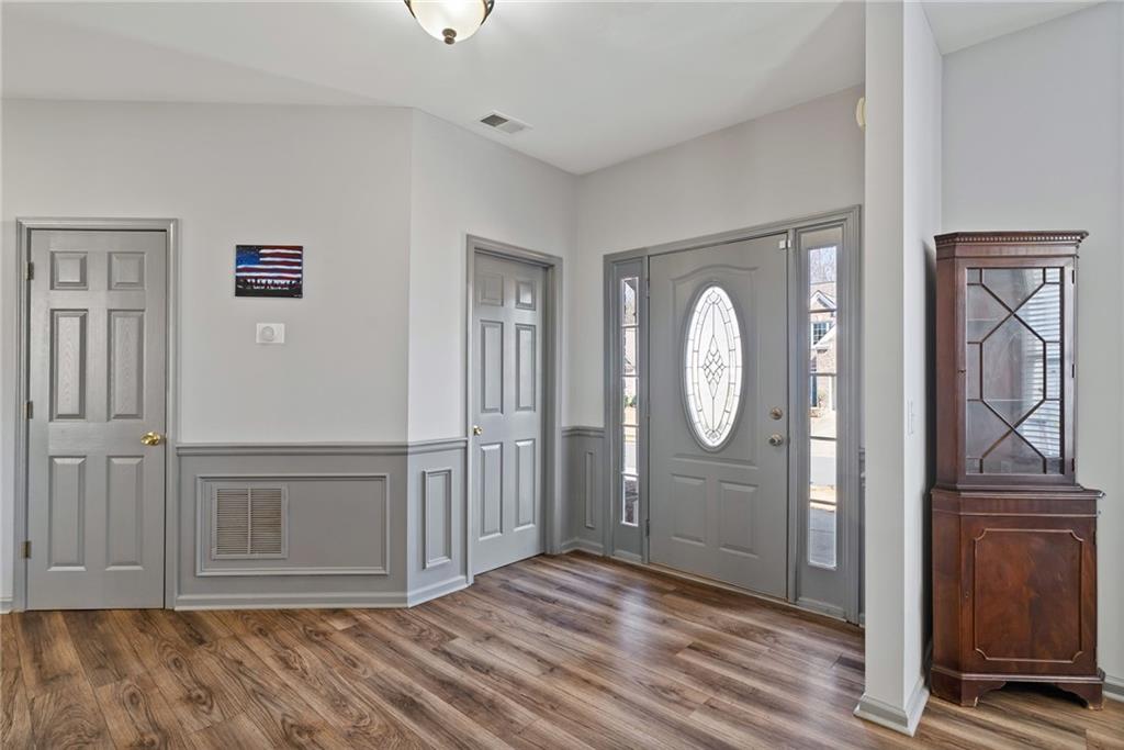 232 Springs Crossing Canton, GA 30114 - Photo 12 of 57 a view of a livingroom with wooden floor and a window