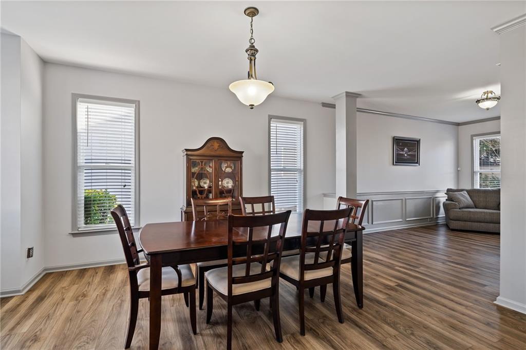 232 Springs Crossing Canton, GA 30114 - Photo 14 of 57 a view of a dining room with furniture and wooden floor