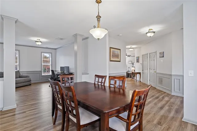 a work room with furniture and wooden floor