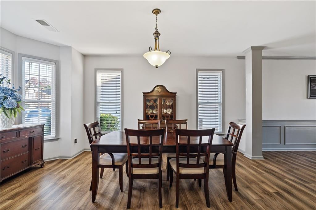 232 Springs Crossing Canton, GA 30114 - Photo 17 of 57 a view of a dining room with furniture window and wooden floor