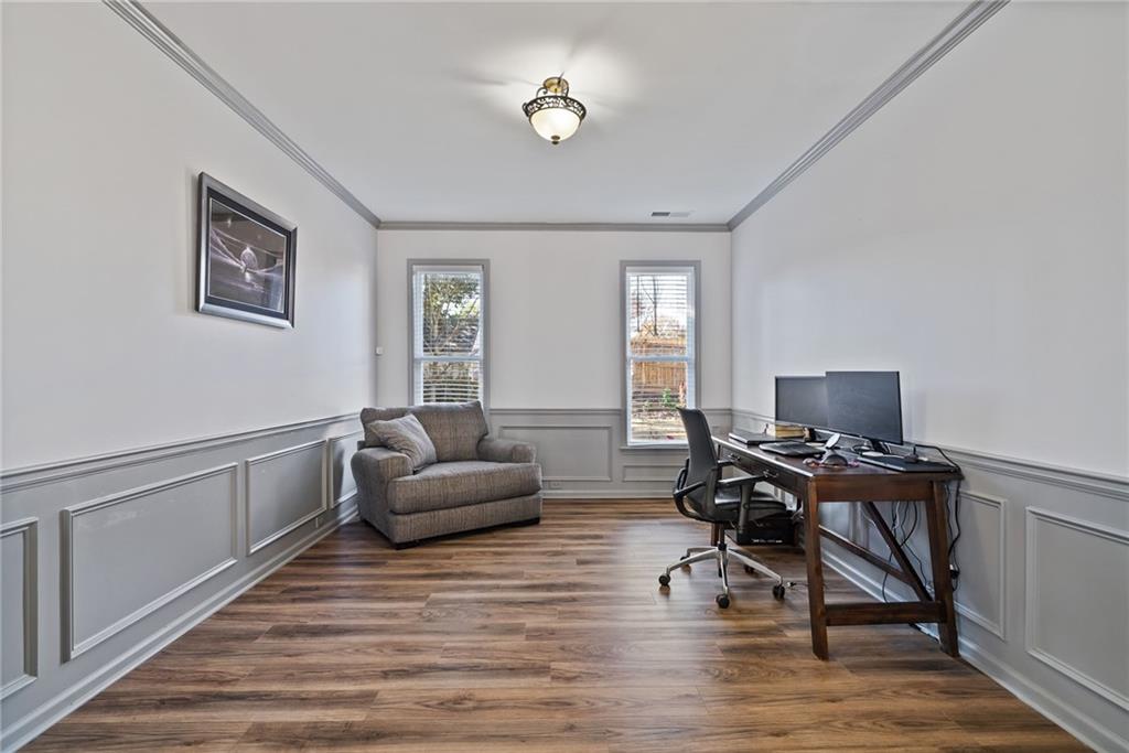 232 Springs Crossing Canton, GA 30114 - Photo 18 of 57 a work room with furniture and wooden floor