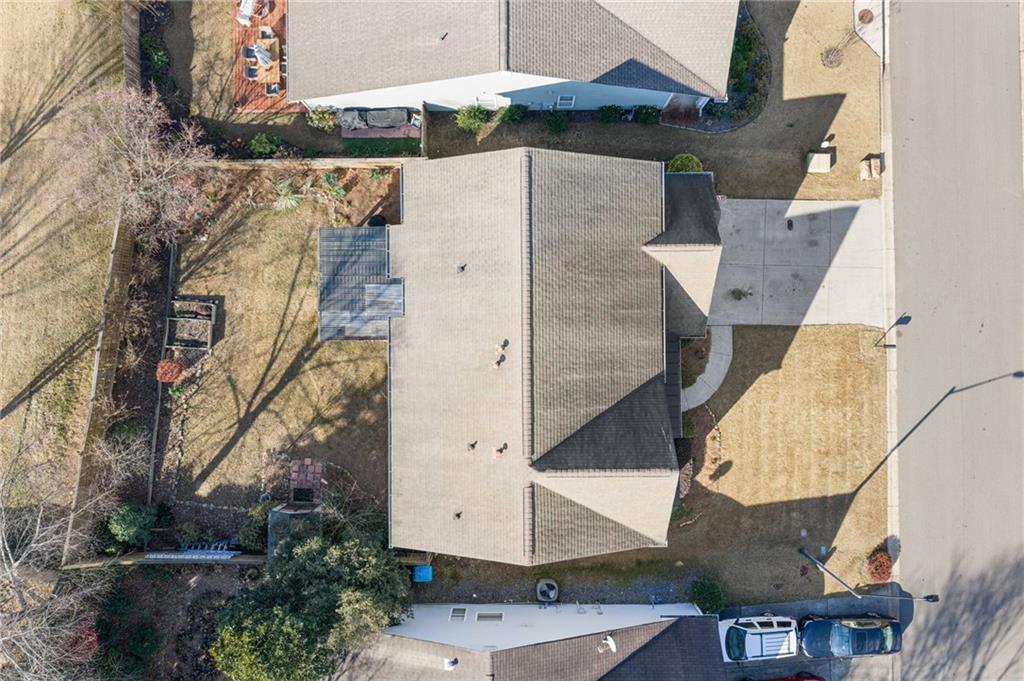 232 Springs Crossing Canton, GA 30114 - Photo 3 of 57 an aerial view of a house with a yard and a large tree