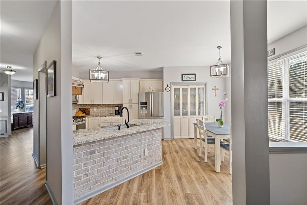 232 Springs Crossing Canton, GA 30114 - Photo 32 of 57 a spacious bathroom with a granite countertop tub sink and mirror