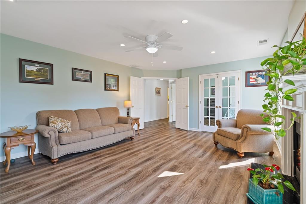 232 Springs Crossing Canton, GA 30114 - Photo 34 of 57 a living room with furniture and flowers