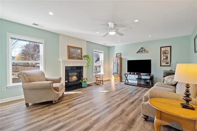 a bathroom with a double vanity sink mirror and bathtub