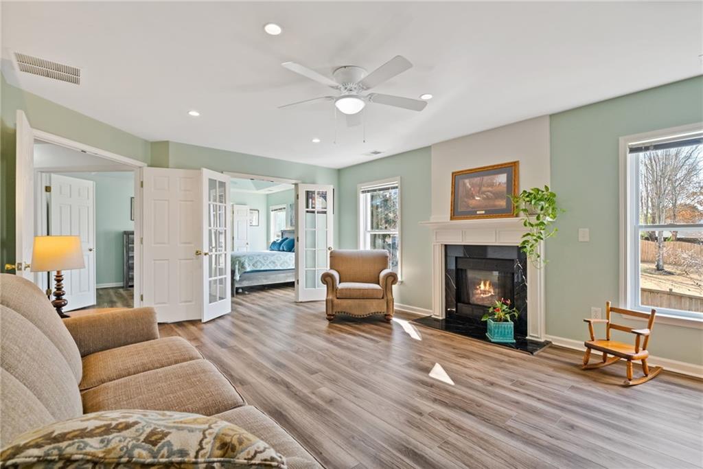 232 Springs Crossing Canton, GA 30114 - Photo 36 of 57 a living room with furniture and a fireplace