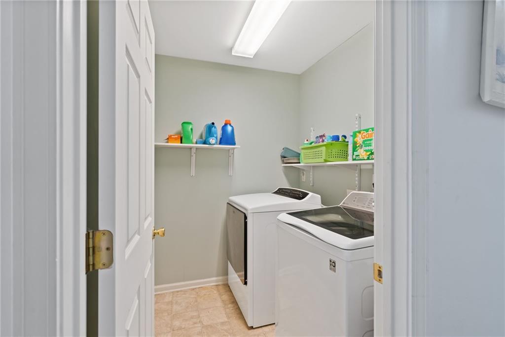 232 Springs Crossing Canton, GA 30114 - Photo 41 of 57 a utility room with dryer and washer