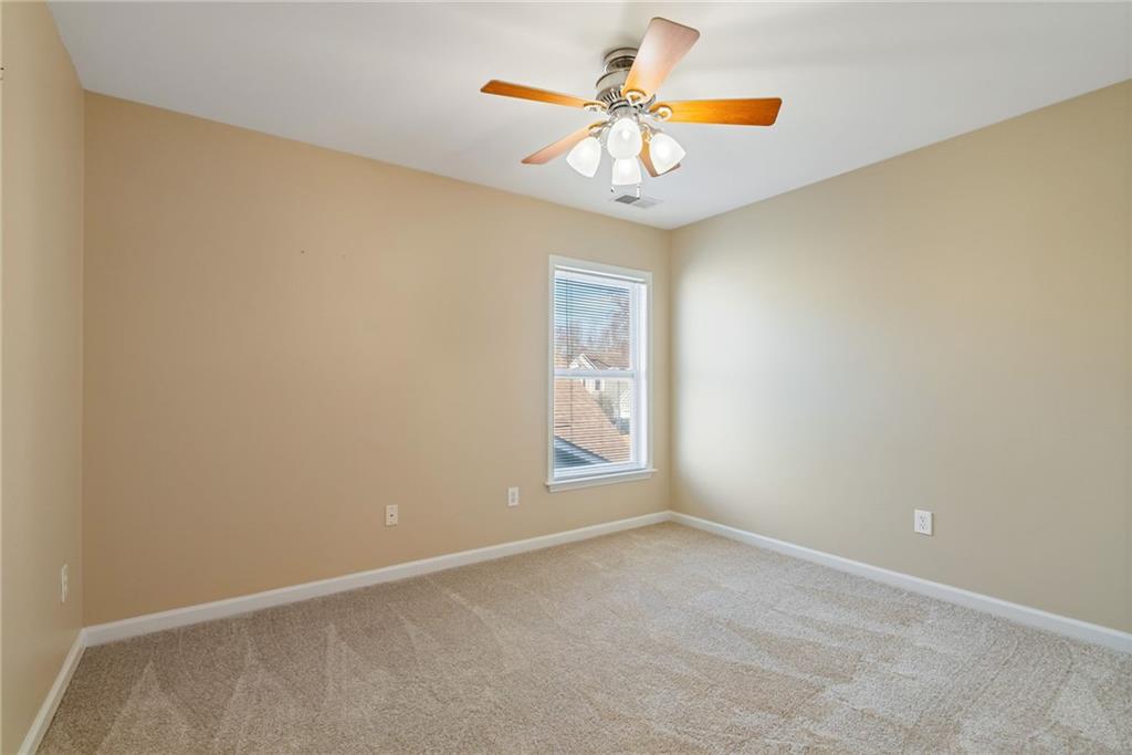 232 Springs Crossing Canton, GA 30114 - Photo 42 of 57 an empty room with a window