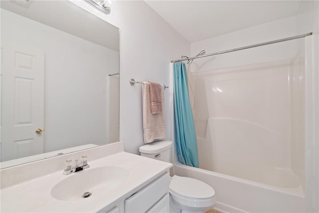 232 Springs Crossing Canton, GA 30114 - Photo 44 of 57 a bathroom with a sink toilet and shower