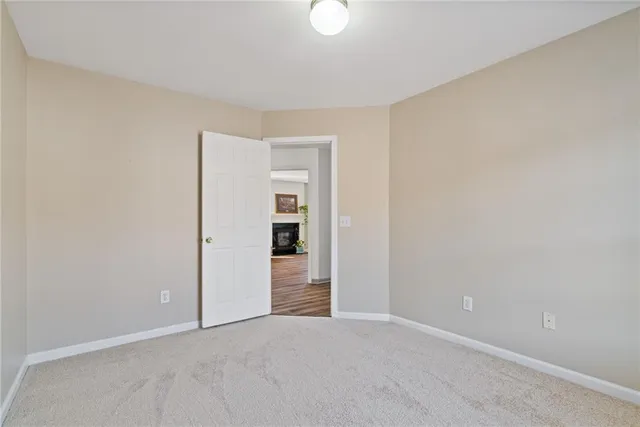 a view of a porch with furniture and a yard