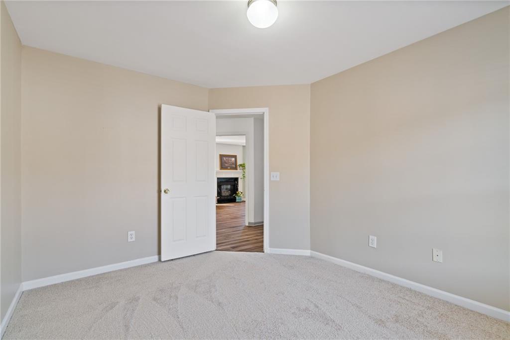 232 Springs Crossing Canton, GA 30114 - Photo 46 of 57 an empty room with closet and windows