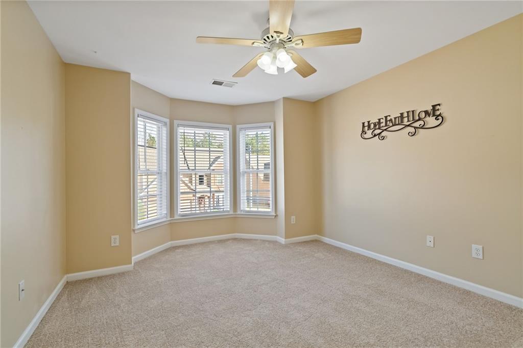 232 Springs Crossing Canton, GA 30114 - Photo 47 of 57 a view of an empty room with a window