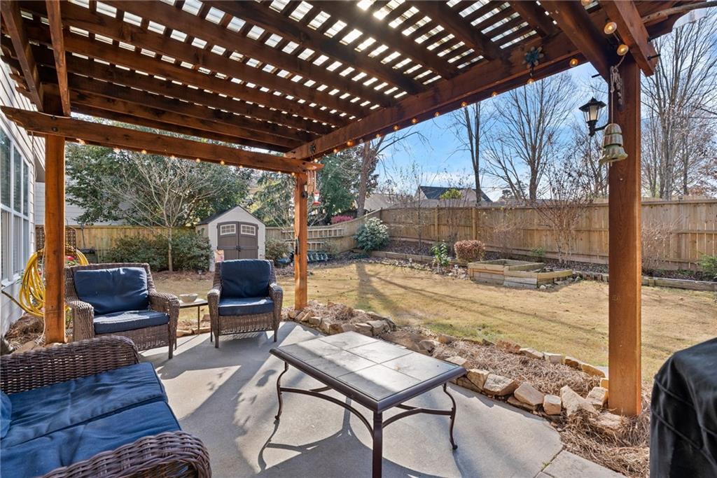 232 Springs Crossing Canton, GA 30114 - Photo 50 of 57 a view of a porch with furniture and a yard