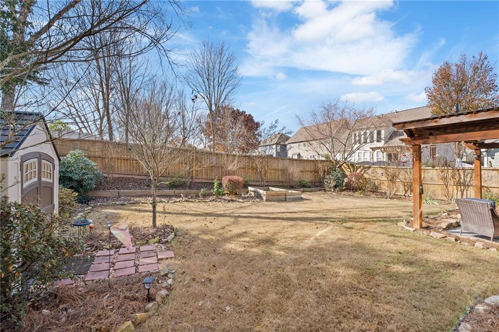 232 Springs Crossing Canton, GA 30114 - Photo 54 of 57 a view of a yard with a house