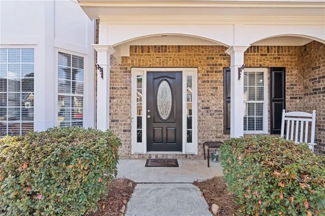 a view of a livingroom with wooden floor and a window