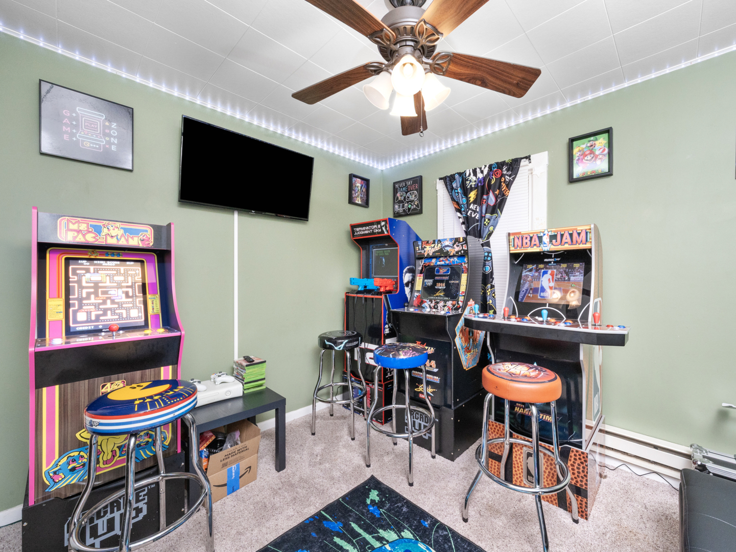 1446 Erie Street Ottawa, IL 61350 - Photo 16 of 41 a living room with furniture a flat screen tv and a ceiling fan