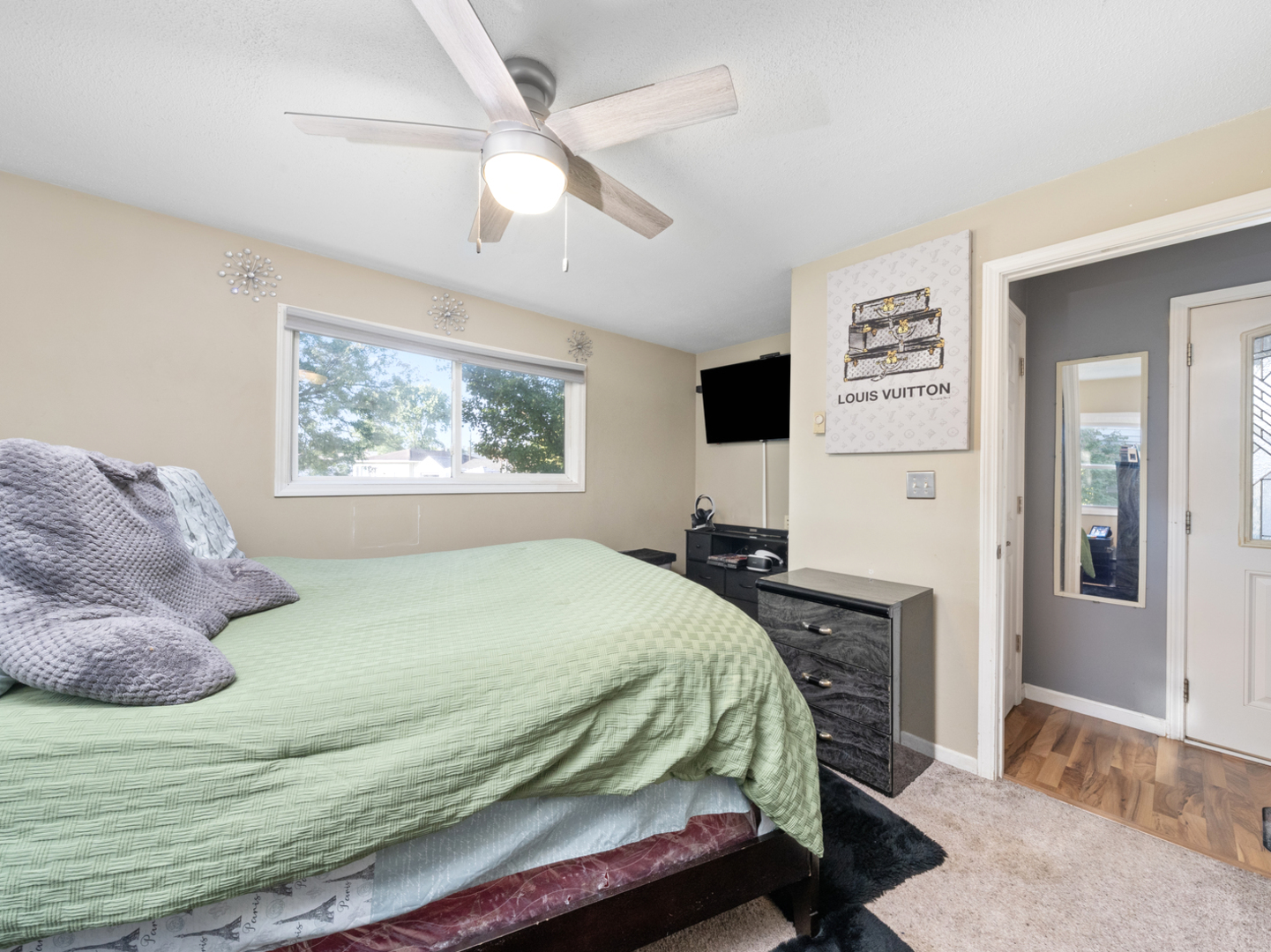 1446 Erie Street Ottawa, IL 61350 - Photo 20 of 41 a bedroom with a large bed and a large window