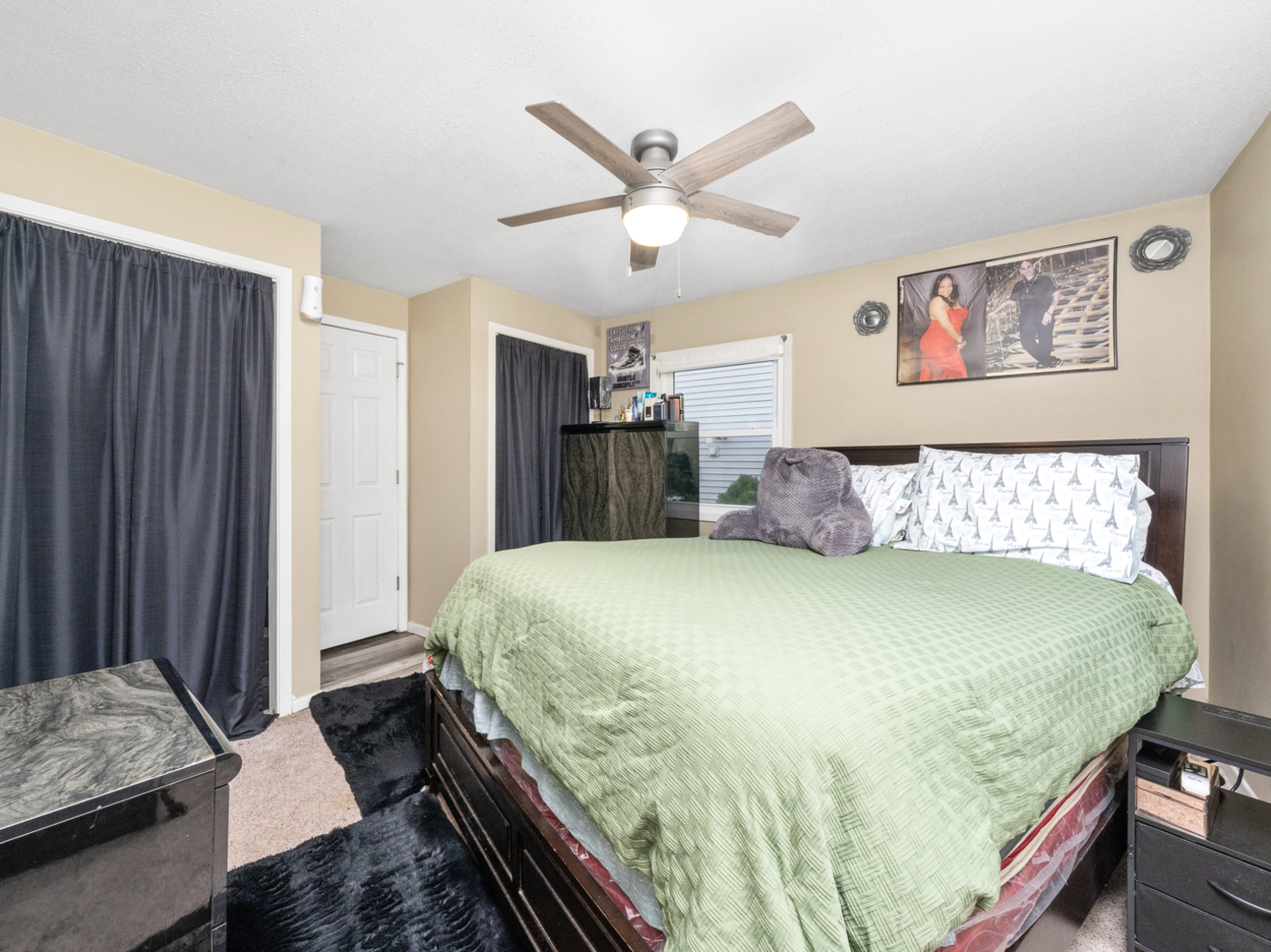 1446 Erie Street Ottawa, IL 61350 - Photo 21 of 41 a bed sitting in a bedroom next to a window