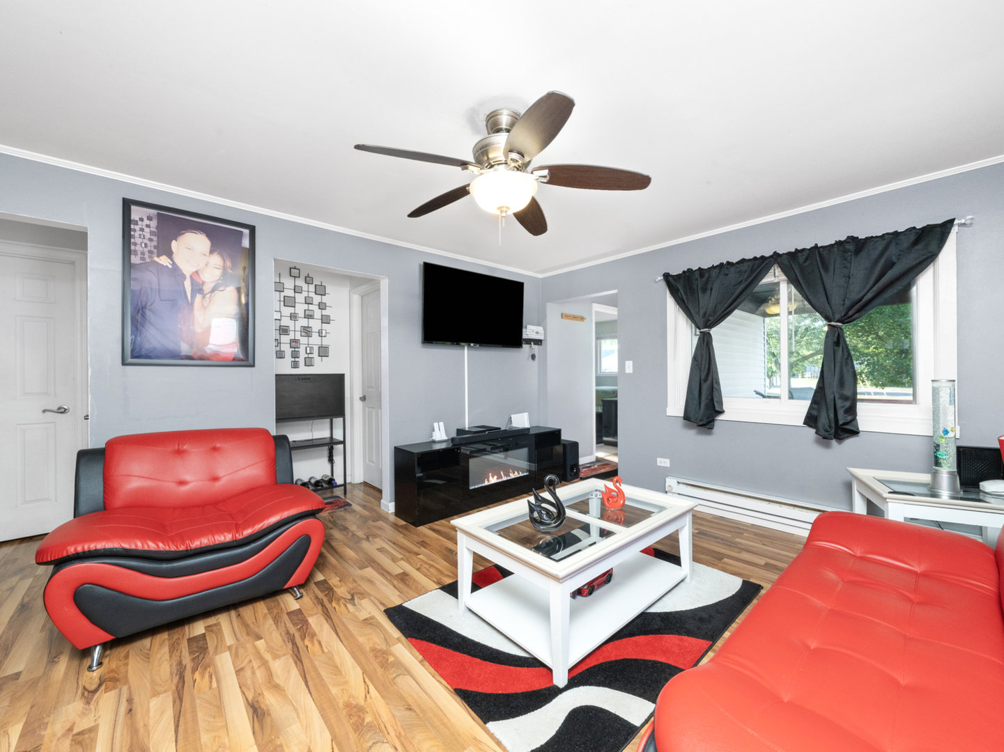 1446 Erie Street Ottawa, IL 61350 - Photo 5 of 41 a living room with furniture and a flat screen tv