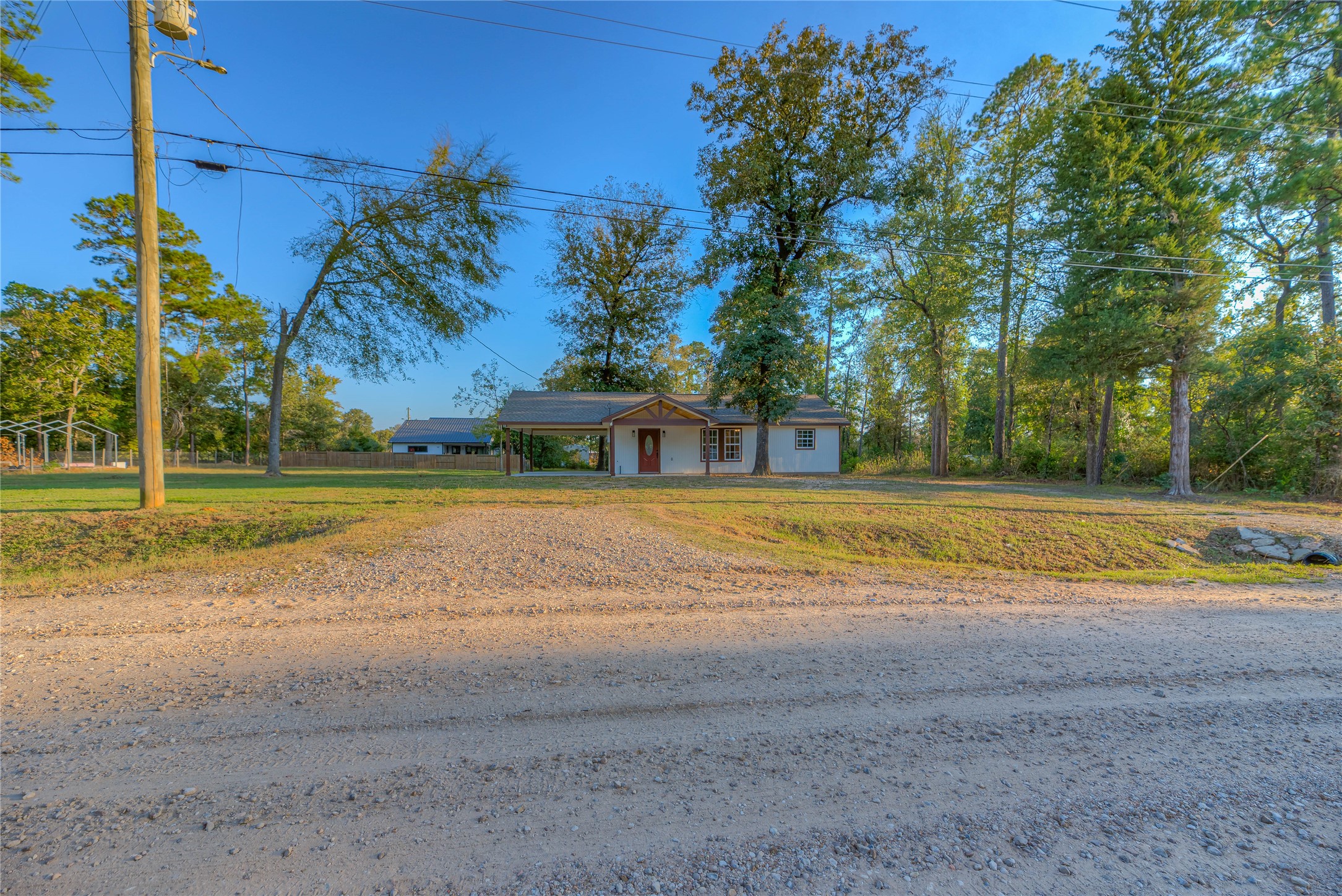 388 Sunrise Wood Road Goodrich, TX 77335 - Photo 29 of 33 a view of the house with a swimming pool