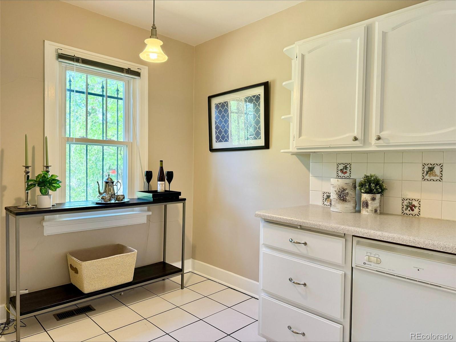 1175 Cook Street Denver, CO 80206 - Photo 13 of 42 a kitchen with a cabinets and window