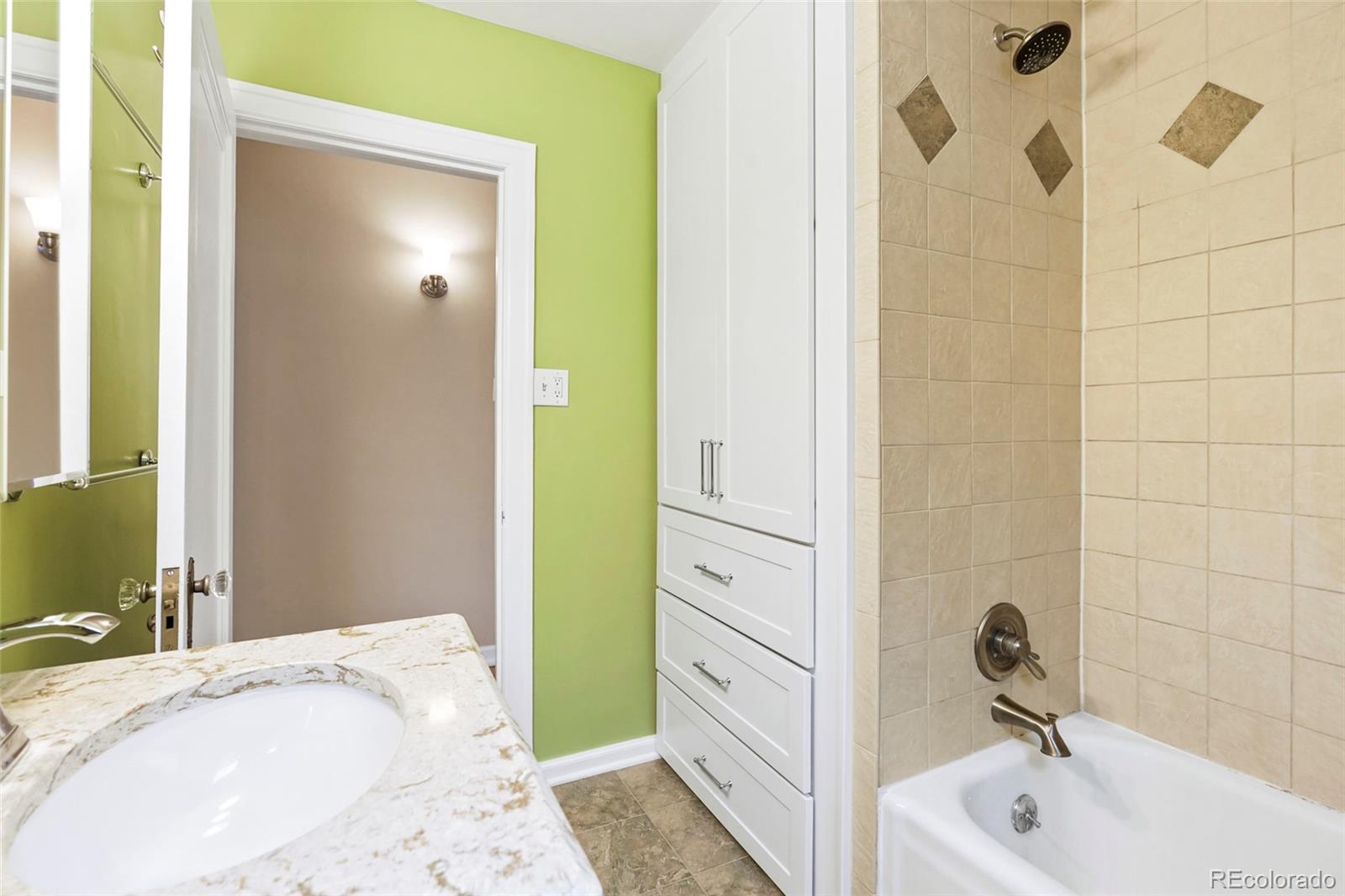 1175 Cook Street Denver, CO 80206 - Photo 15 of 42 a bathroom with a sink and a tub