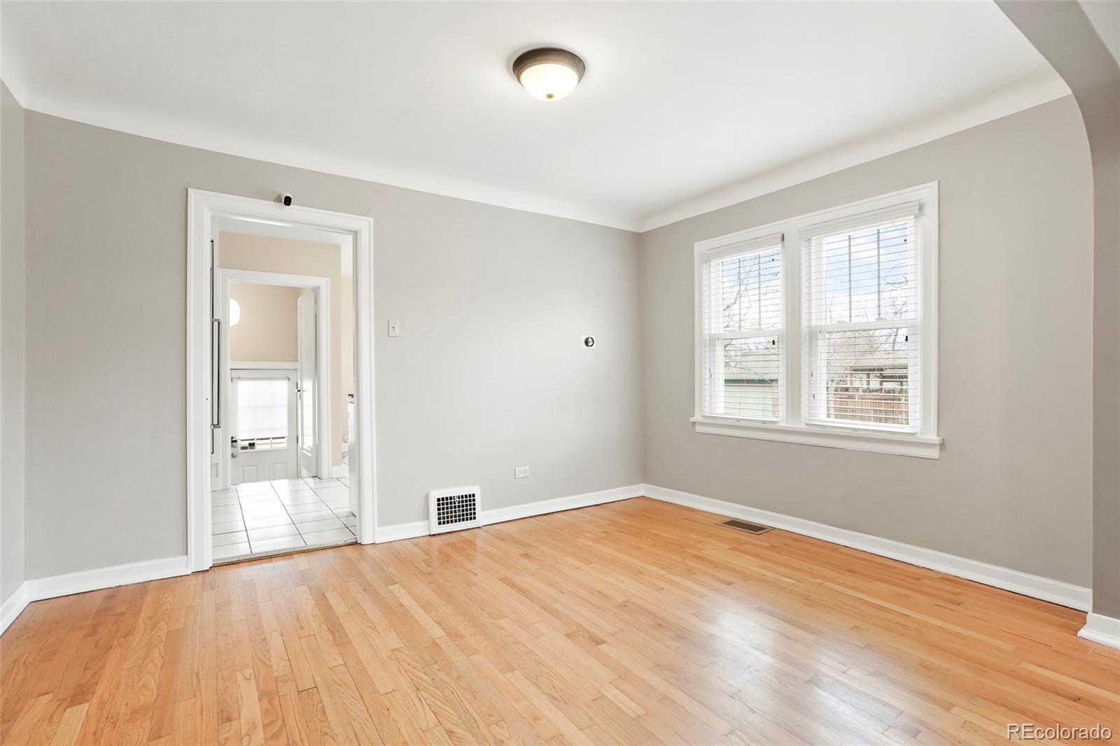 1175 Cook Street Denver, CO 80206 - Photo 19 of 42 a view of empty room with wooden floor and fan