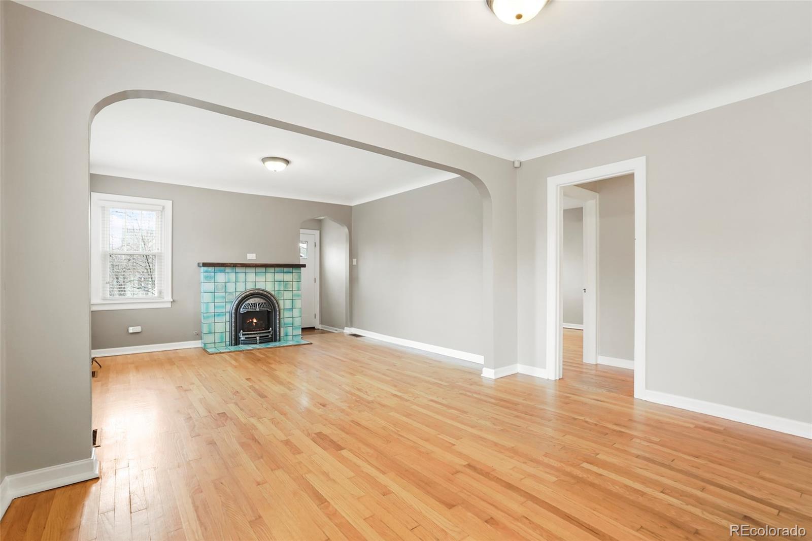1175 Cook Street Denver, CO 80206 - Photo 20 of 42 a view of a livingroom with a fireplace and a window