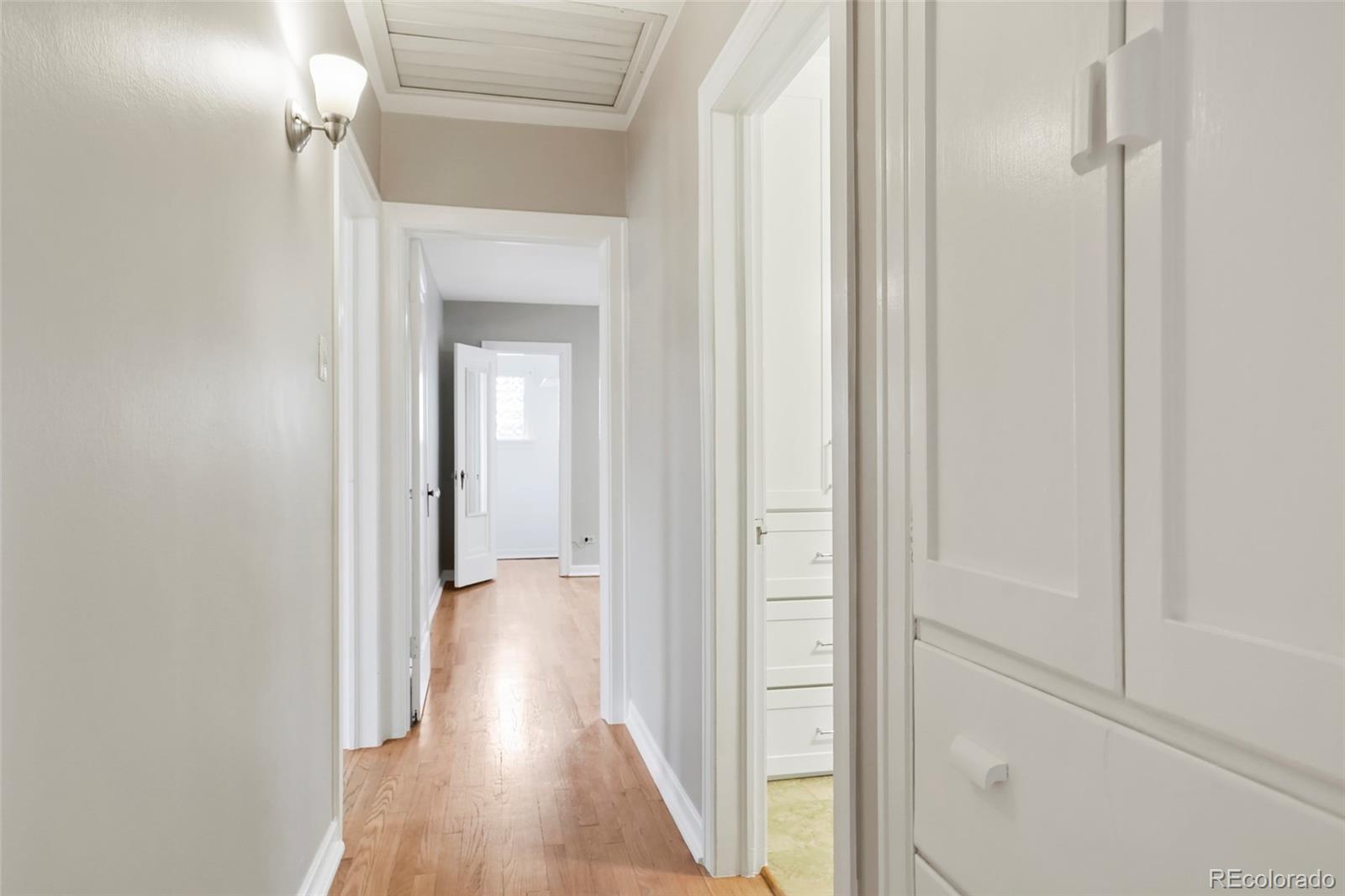 1175 Cook Street Denver, CO 80206 - Photo 24 of 42 a view of a hallway with wooden floor