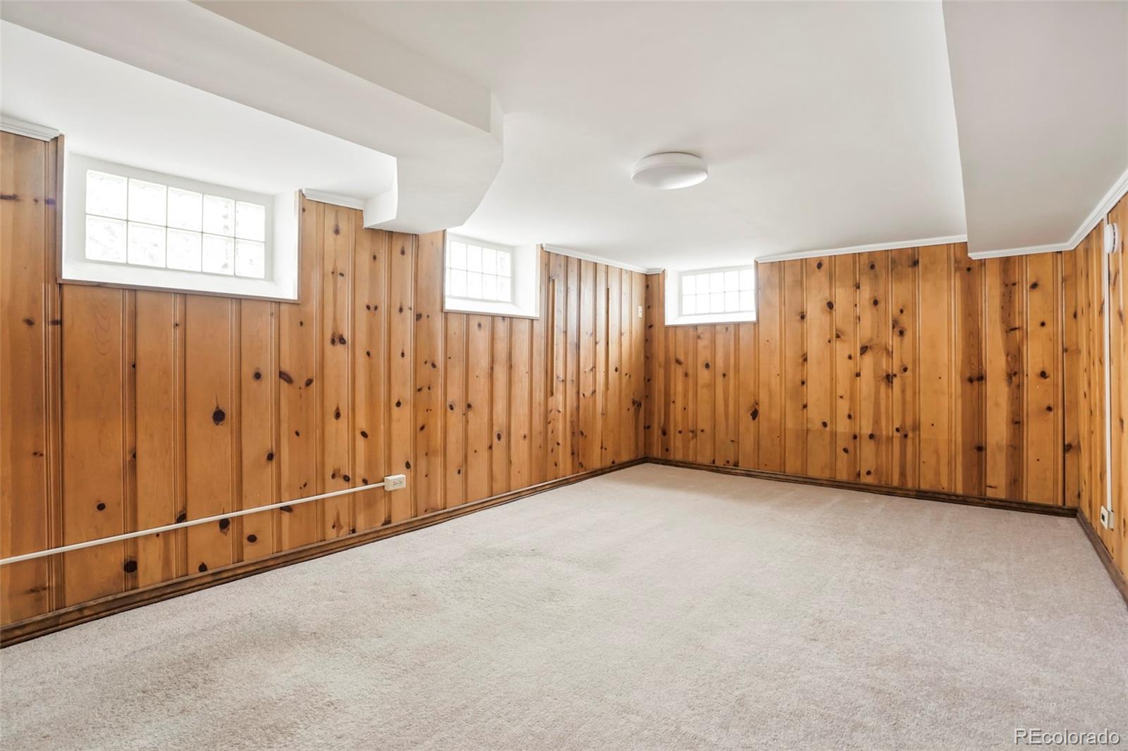 1175 Cook Street Denver, CO 80206 - Photo 27 of 42 an empty room with a wooden door