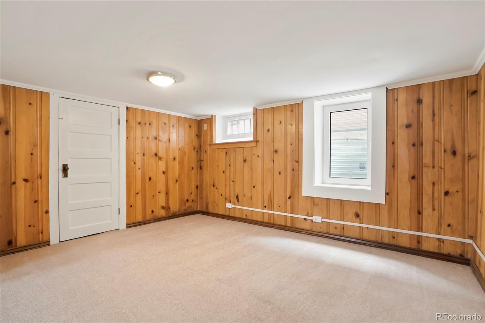 1175 Cook Street Denver, CO 80206 - Photo 28 of 42 a view of an empty room with a window