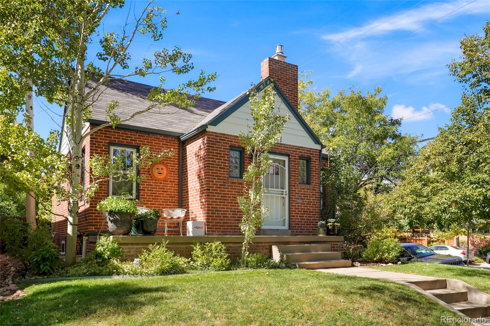 1175 Cook Street Denver, CO 80206 - Photo 3 of 42 front view of house with a yard