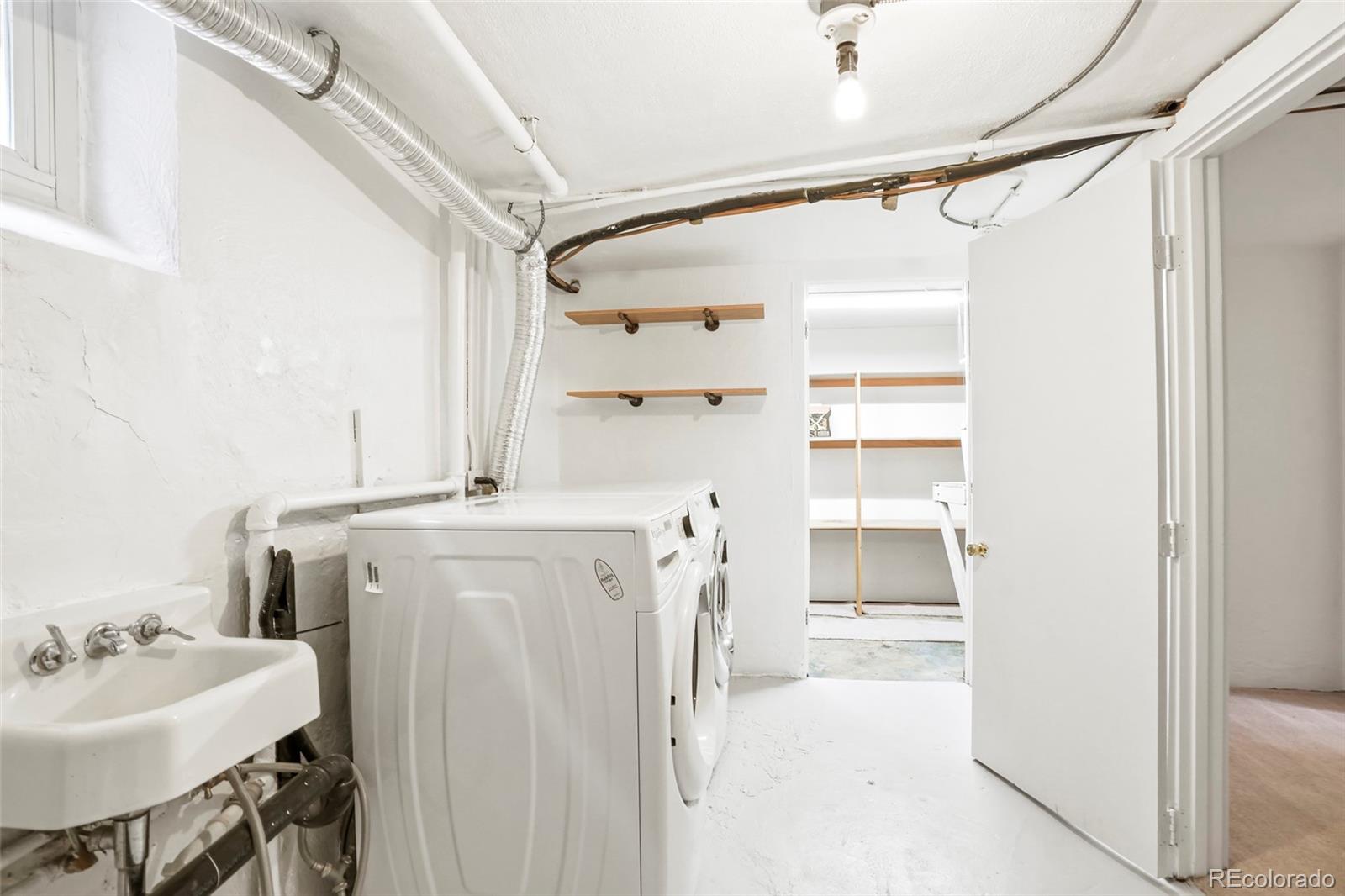 1175 Cook Street Denver, CO 80206 - Photo 31 of 42 a bathroom with a sink toilet and shower