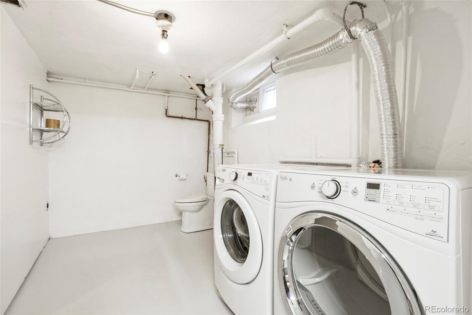 1175 Cook Street Denver, CO 80206 - Photo 32 of 42 a view of a storage & utility room with dryer and washer
