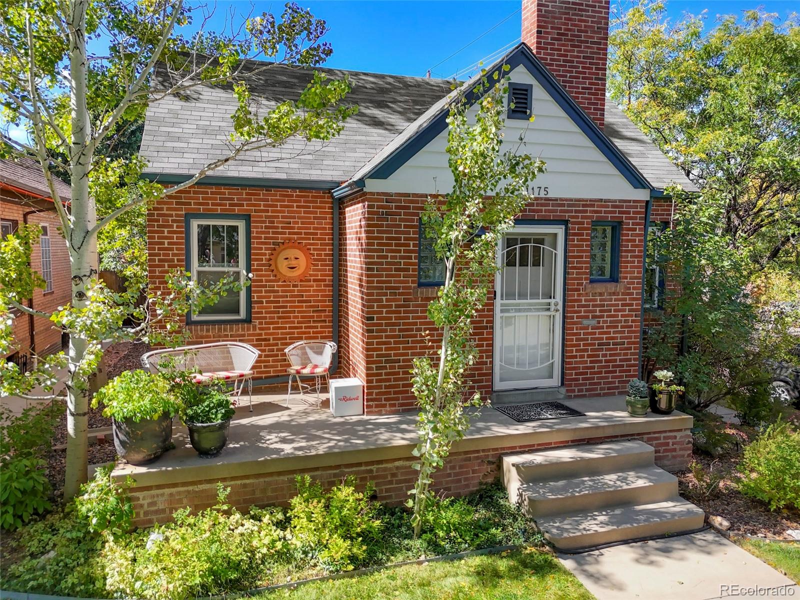 1175 Cook Street Denver, CO 80206 - Photo 4 of 42 a front view of a house with garden