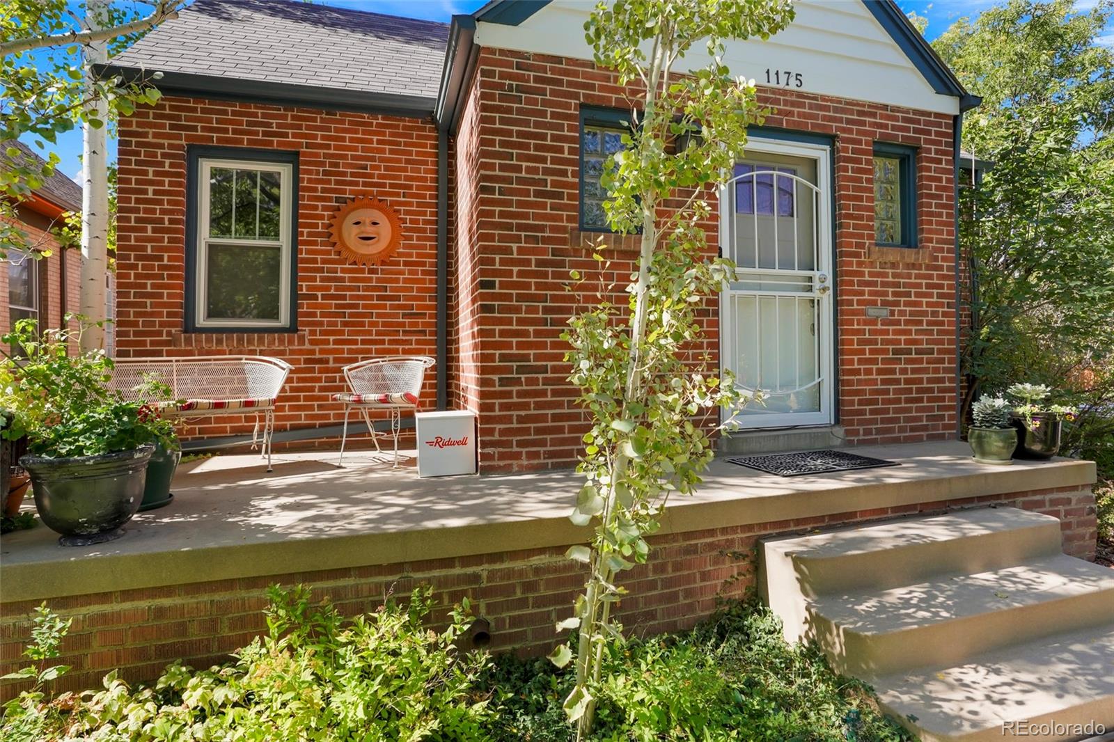 1175 Cook Street Denver, CO 80206 - Photo 5 of 42 a view of a house with potted plants