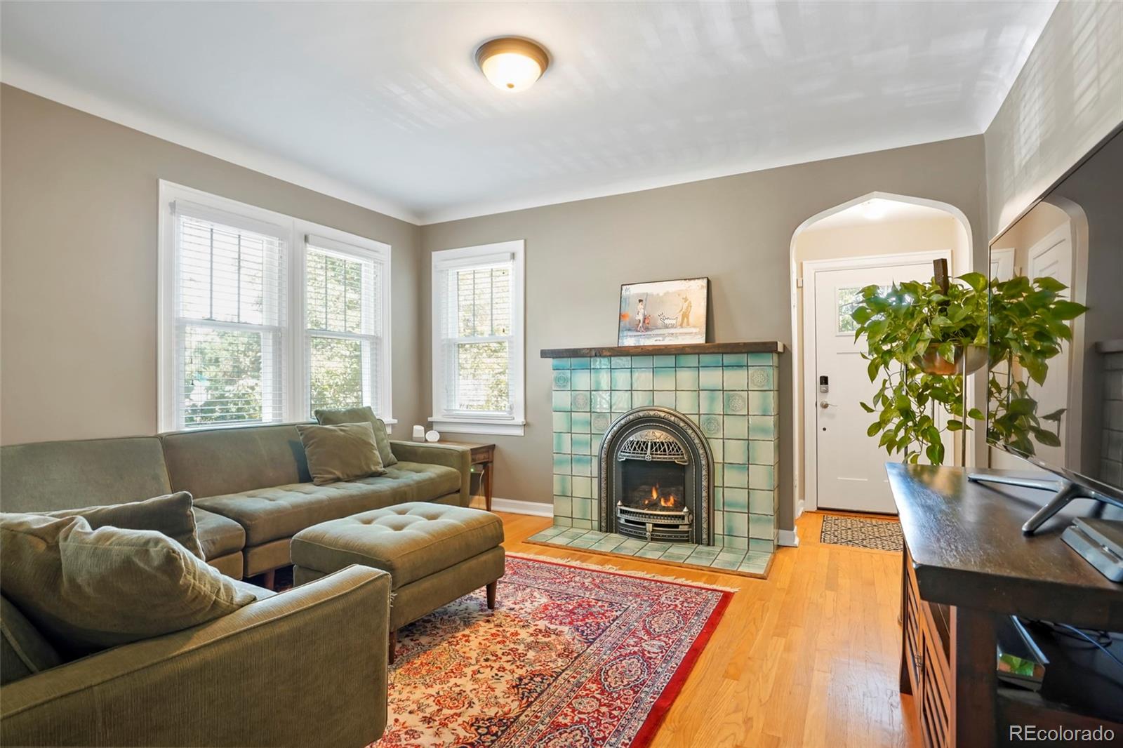1175 Cook Street Denver, CO 80206 - Photo 7 of 42 a living room with furniture and a fireplace