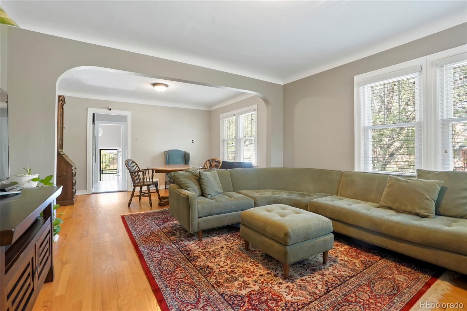 1175 Cook Street Denver, CO 80206 - Photo 8 of 42 a living room with furniture and a couch