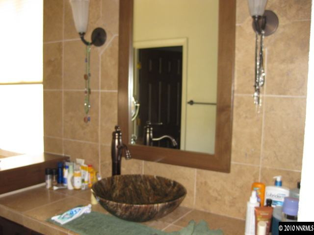 363 Sangre Circle Reno, NV 89511 - Photo 5 of 5 a bathroom with a sink and a mirror