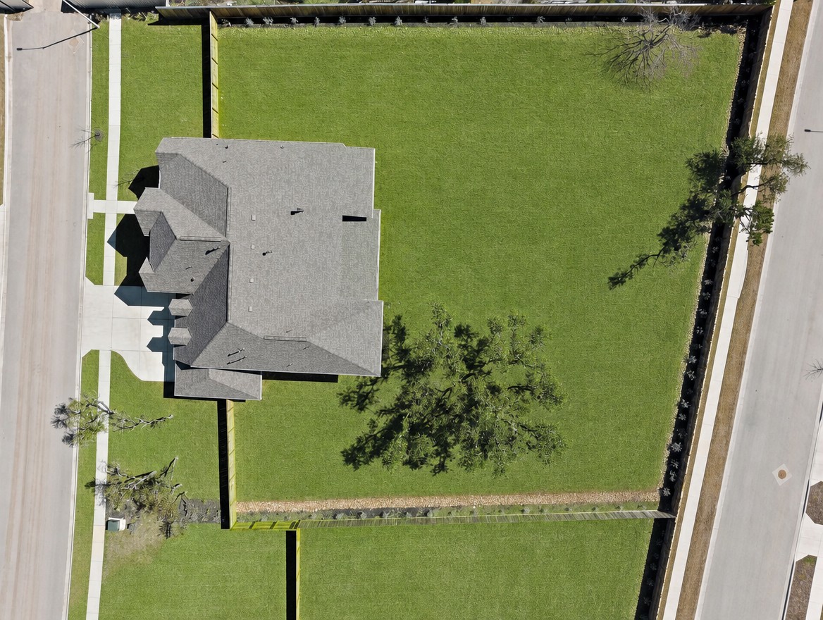 1440 Riva Ridge Drive Leander, TX 78641 - Photo 35 of 37 An aerial perspective showcases a new residence on a generous lot, with ample green space.