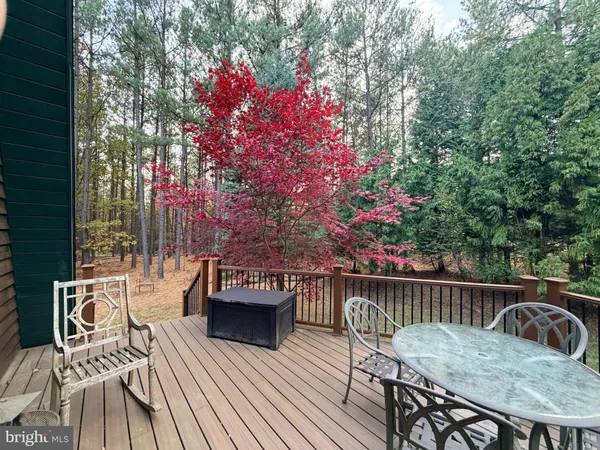 a view of balcony with wooden floor