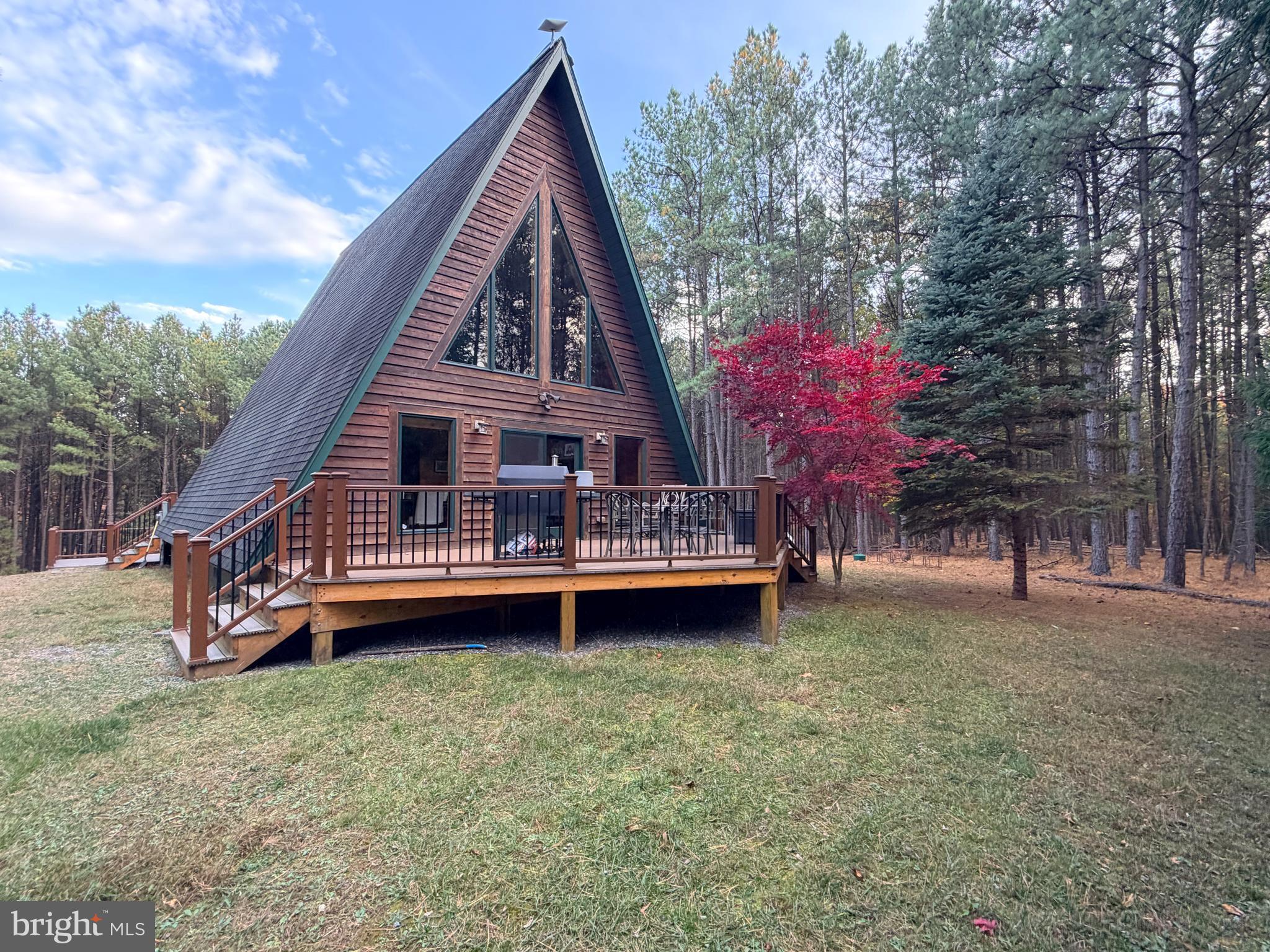 4839 Graces Cabin Road Romney, WV 26757 - Photo 25 of 26 a backyard of a house with table and chairs