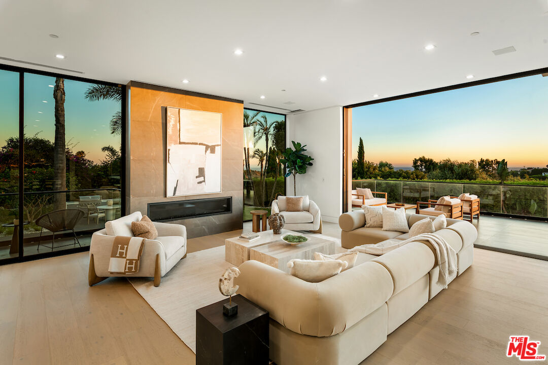5931 Kanan Dume Road Malibu, CA 90265 - Photo 11 of 50 a living room with furniture and a large window
