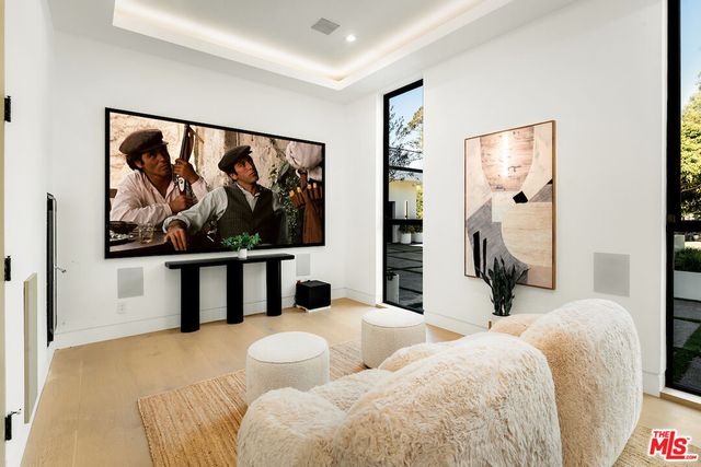 a view of a livingroom with furniture and an empty room