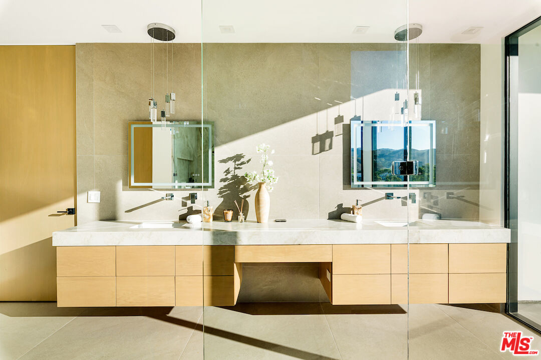 5931 Kanan Dume Road Malibu, CA 90265 - Photo 27 of 50 a bathroom with a sink and a mirror