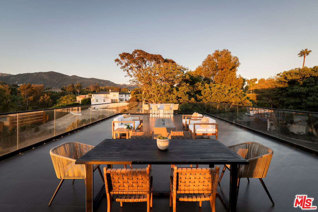 5931 Kanan Dume Road Malibu, CA 90265 - Photo 32 of 50 a terrace of a house with outdoor seating