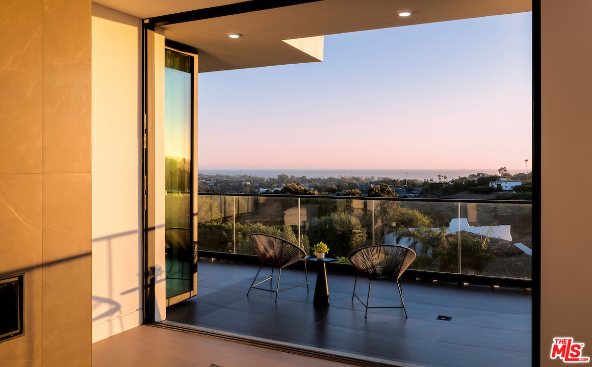 5931 Kanan Dume Road Malibu, CA 90265 - Photo 33 of 50 a view of a lake from a balcony
