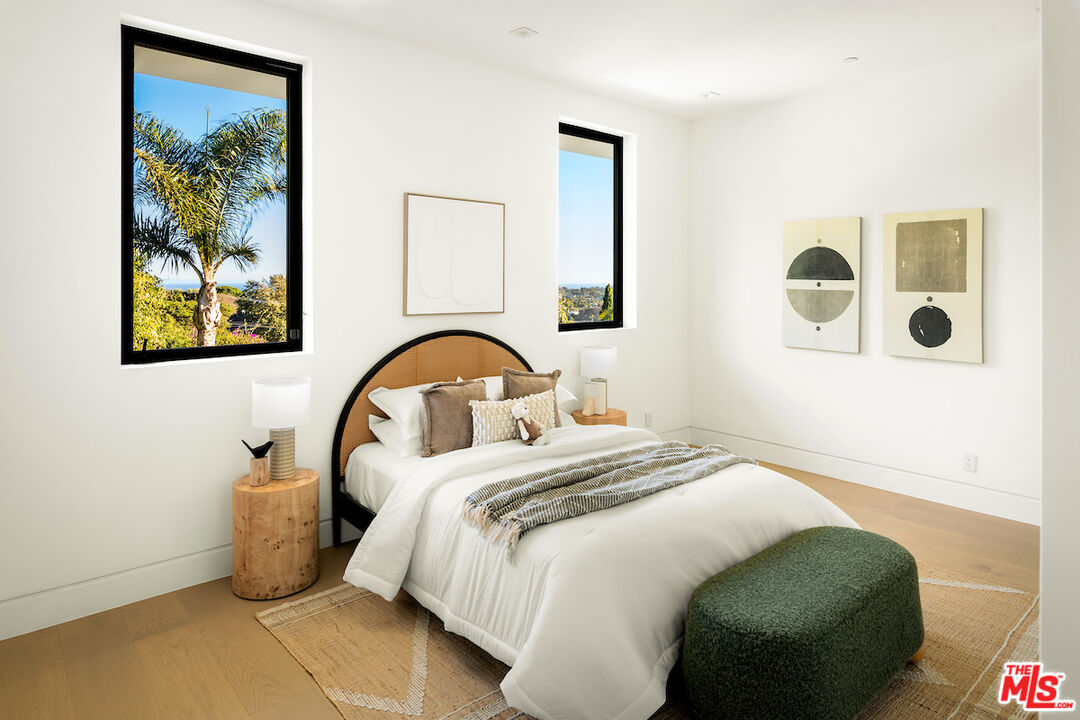 5931 Kanan Dume Road Malibu, CA 90265 - Photo 39 of 50 a bedroom with a bed and a painting on the wall