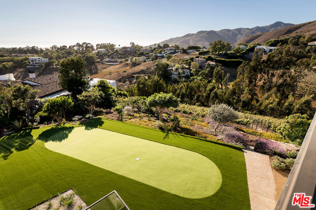 5931 Kanan Dume Road Malibu, CA 90265 - Photo 43 of 50 a view of a swimming pool with a yard